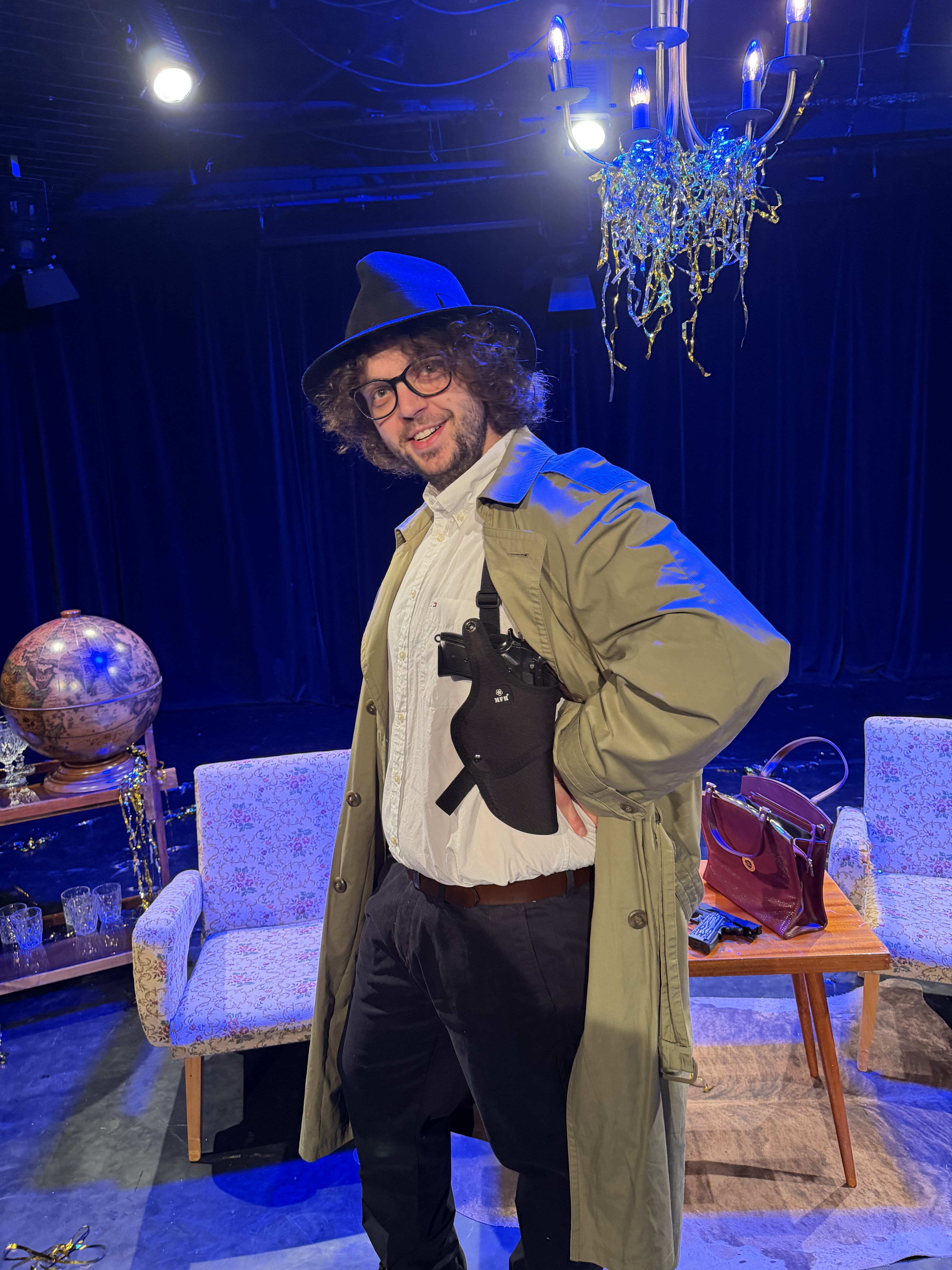 Michal in costume on the set of an amateur theatre production